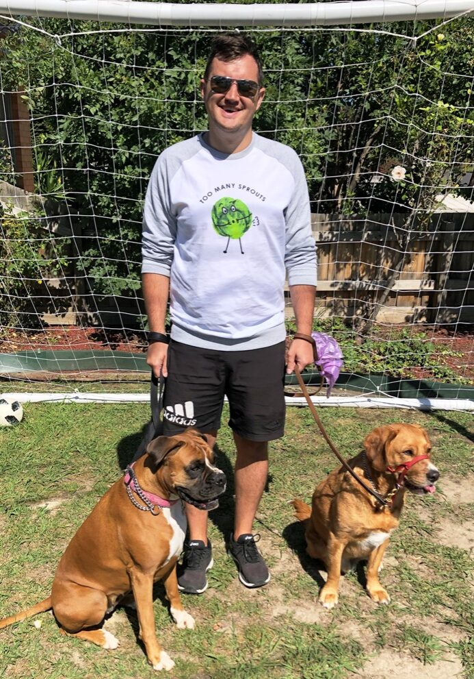 Podiatrist Luke Simpson of Sports & Injury Management, Diamond Creek with his dogs