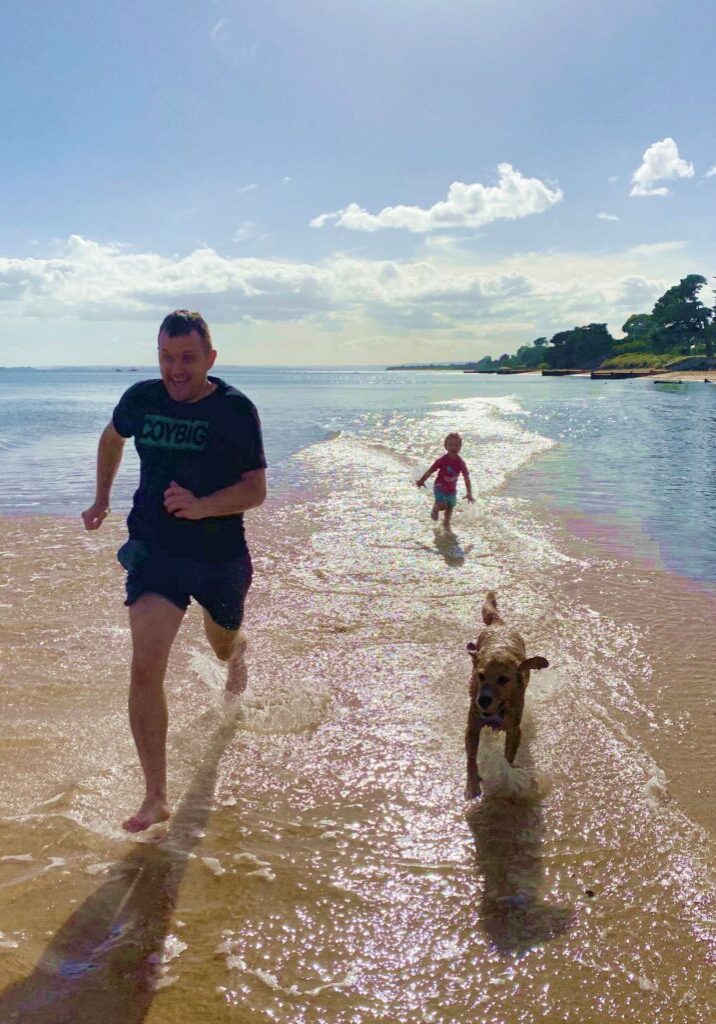 Podiatrist Luke Simpson of Sports & Injury Management, Diamond Creek running on the beach